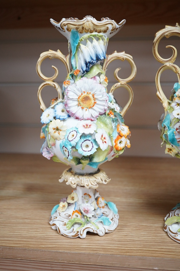 A Coalport garniture vase set with applied flowers, tallest 31cm. Condition - restored